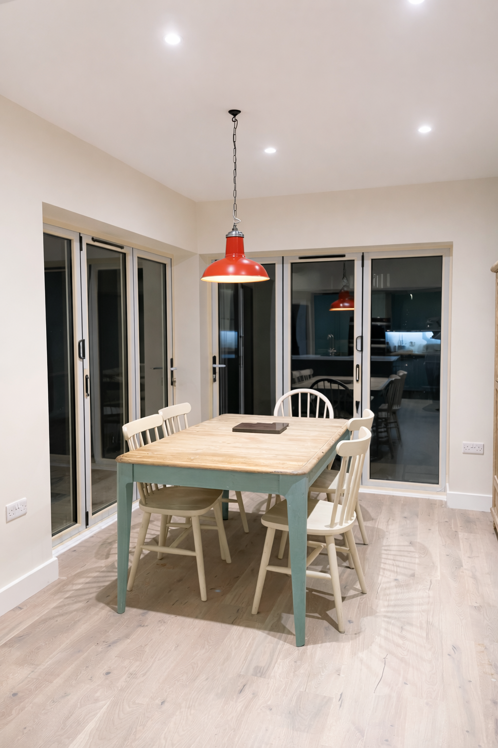 Dining room with modern hybrid flooring installed by RaeAnne Renovations
