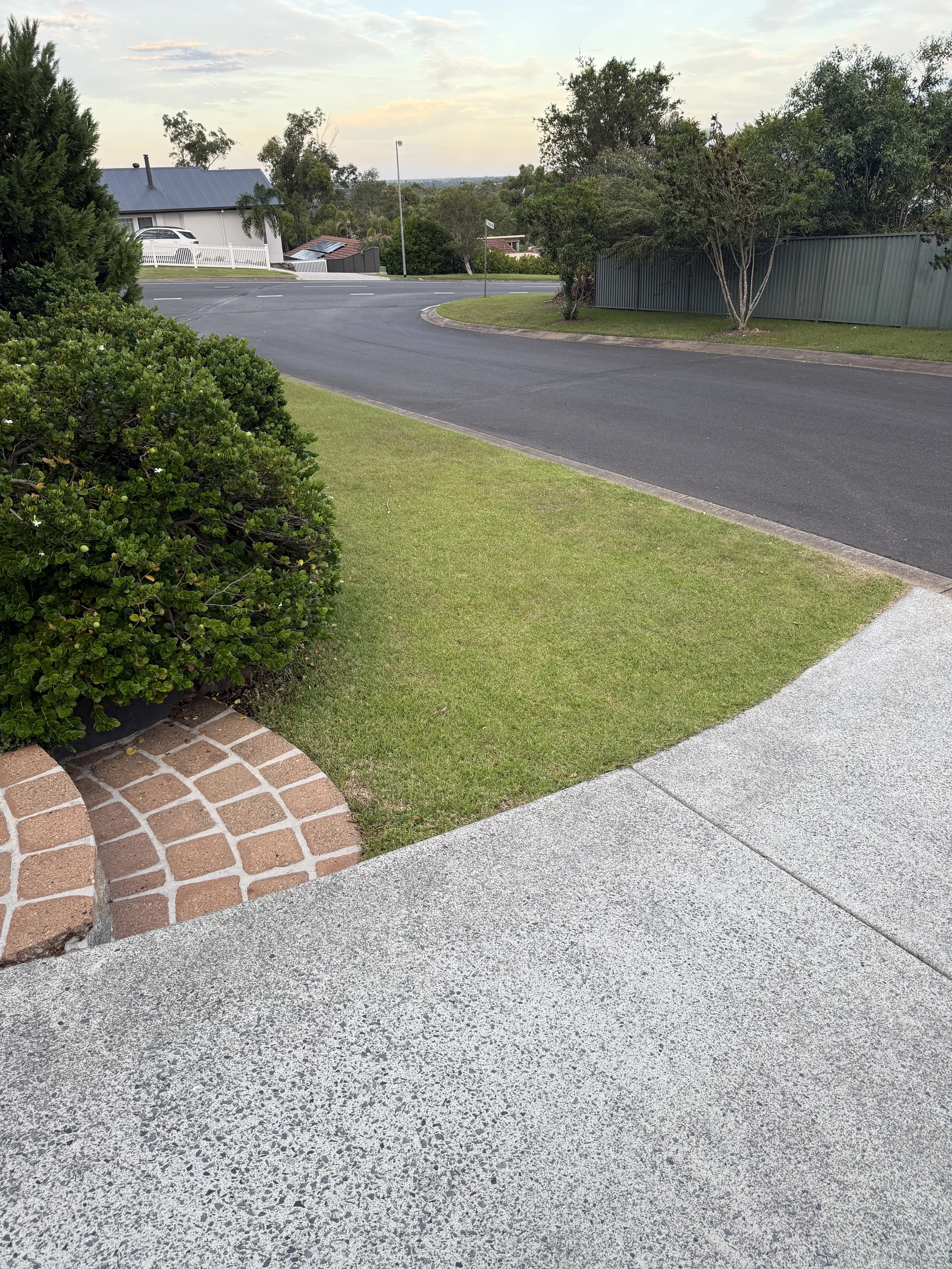 Pressure washed driveway improving street appeal before property sale