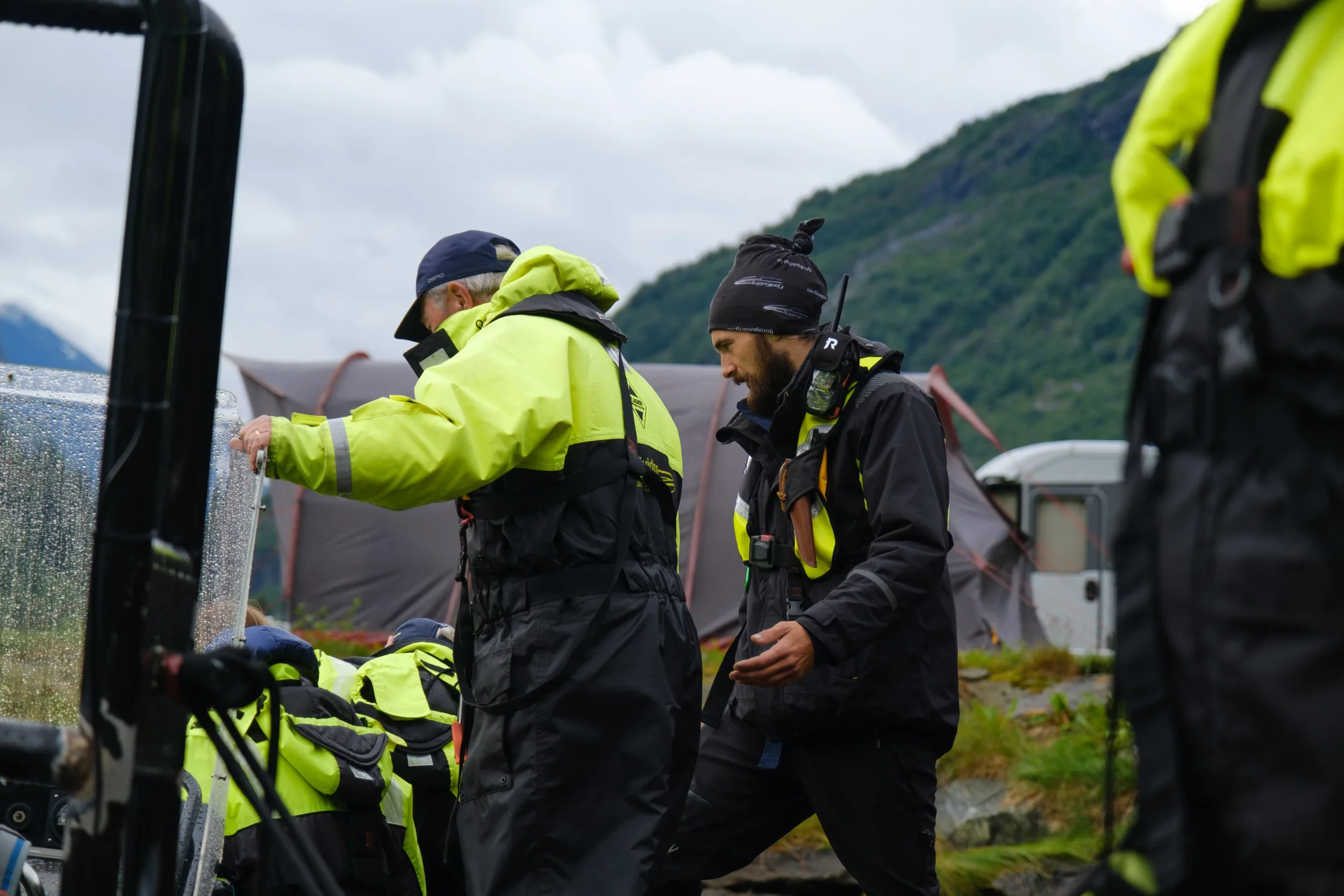 passengers getting onboard rib and preparing for new experience. Guide is assisting