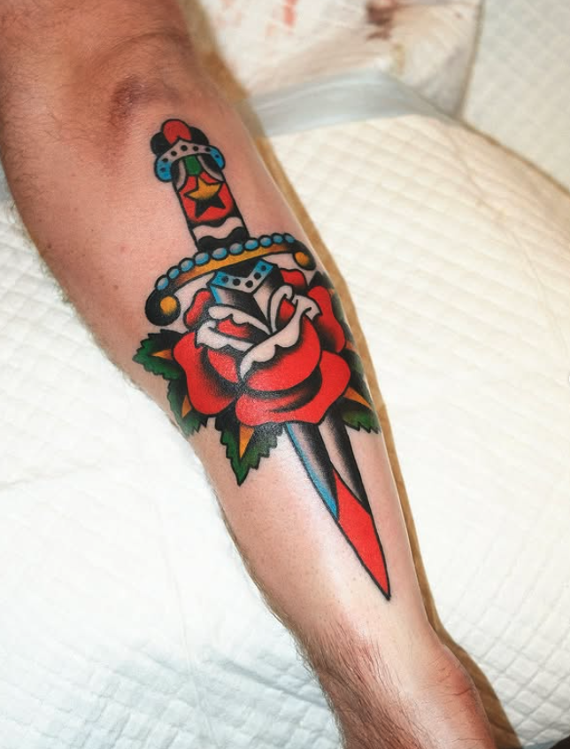 Traditional colour rose and dagger tattoo made by Benjamin Hastings at Tattoo Rosies, Surry Hills, Sydney 