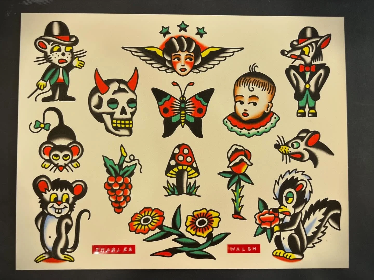Collection of traditional tattoo flash designs featuring stylized images of animals, a butterfly, flowers, a skull, a child, and a woman with a winged face. Styles are bold, colorful, and reminiscent of vintage American tattoo art.