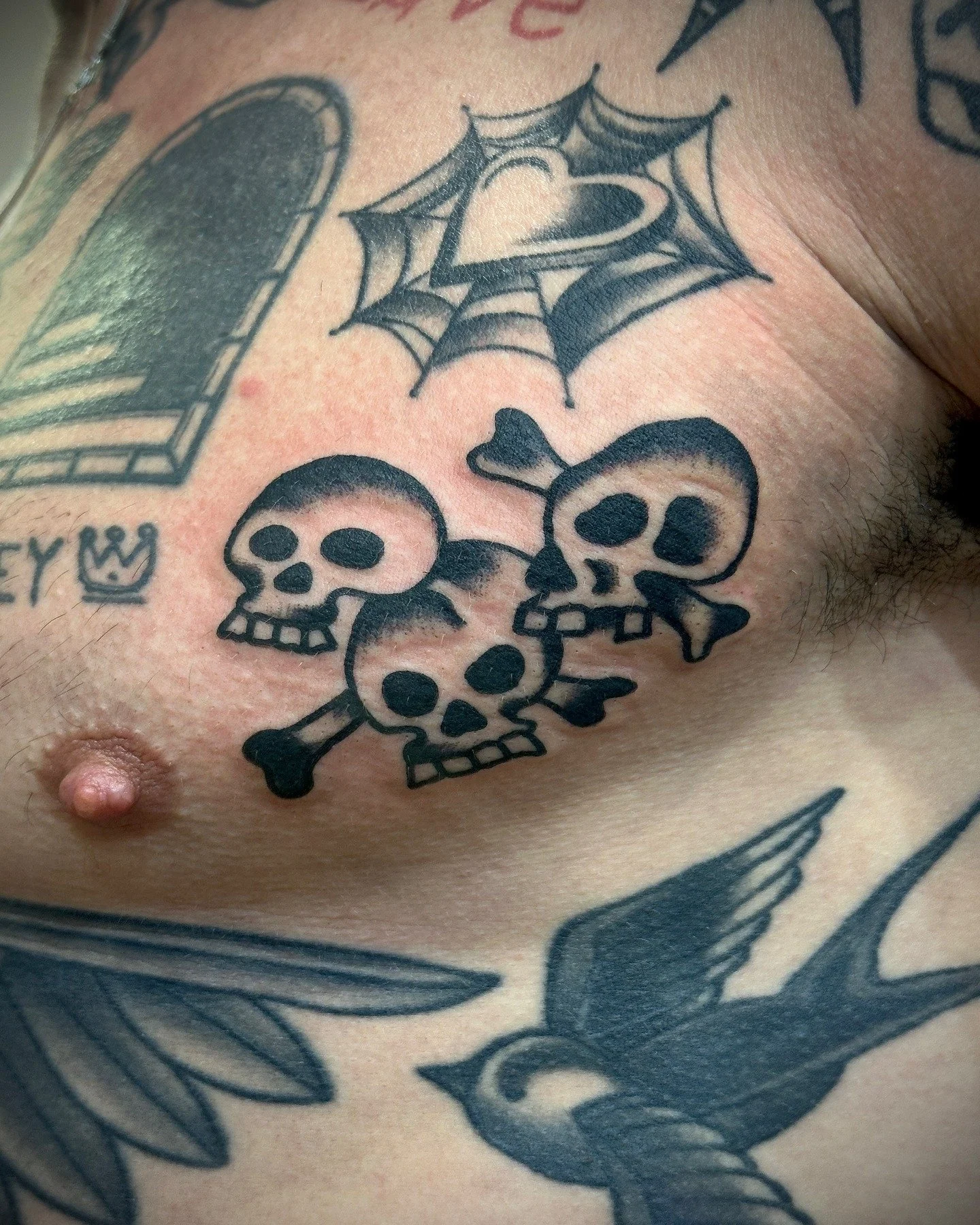 Traditional black and grey skulls tattoo made at Tattoo Rosie's Surry Hills, Sydney
