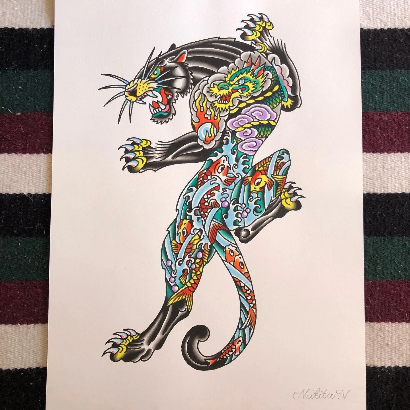 Colorful traditional tattoo-style illustration of a fierce black panther with a serpentine body, adorned with Japanese-style koi fish, clouds, and flames.