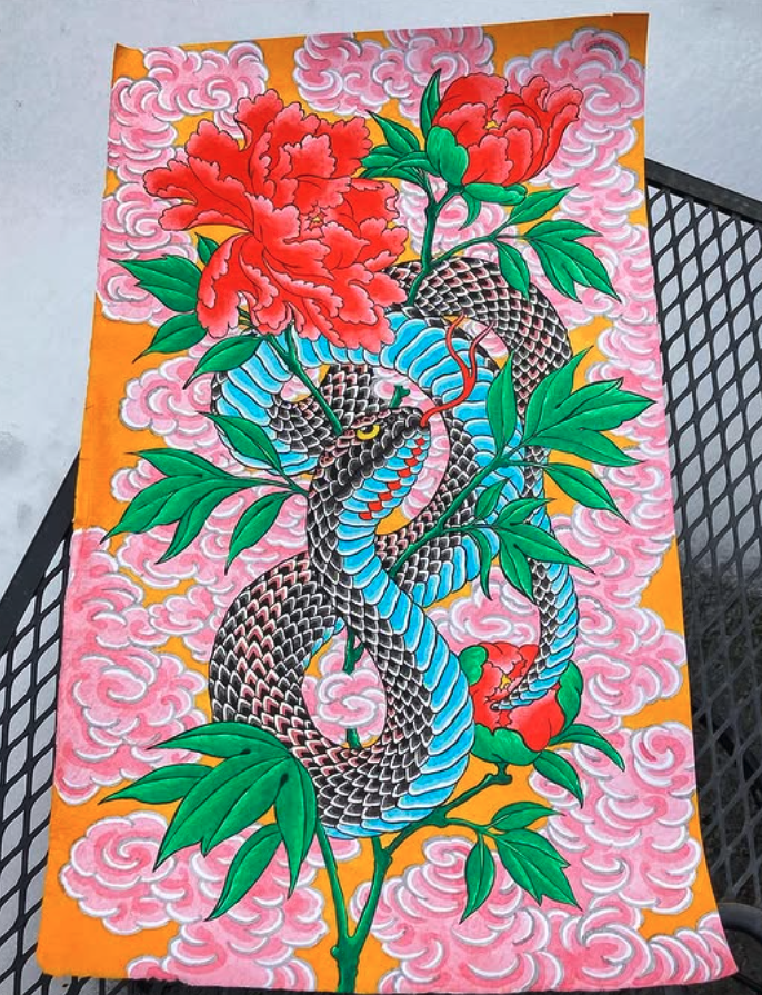 Colorful traditional tattoo-style artwork of a black and blue snake intertwined with green leaves and red peony flowers, set against a pink cloud background.