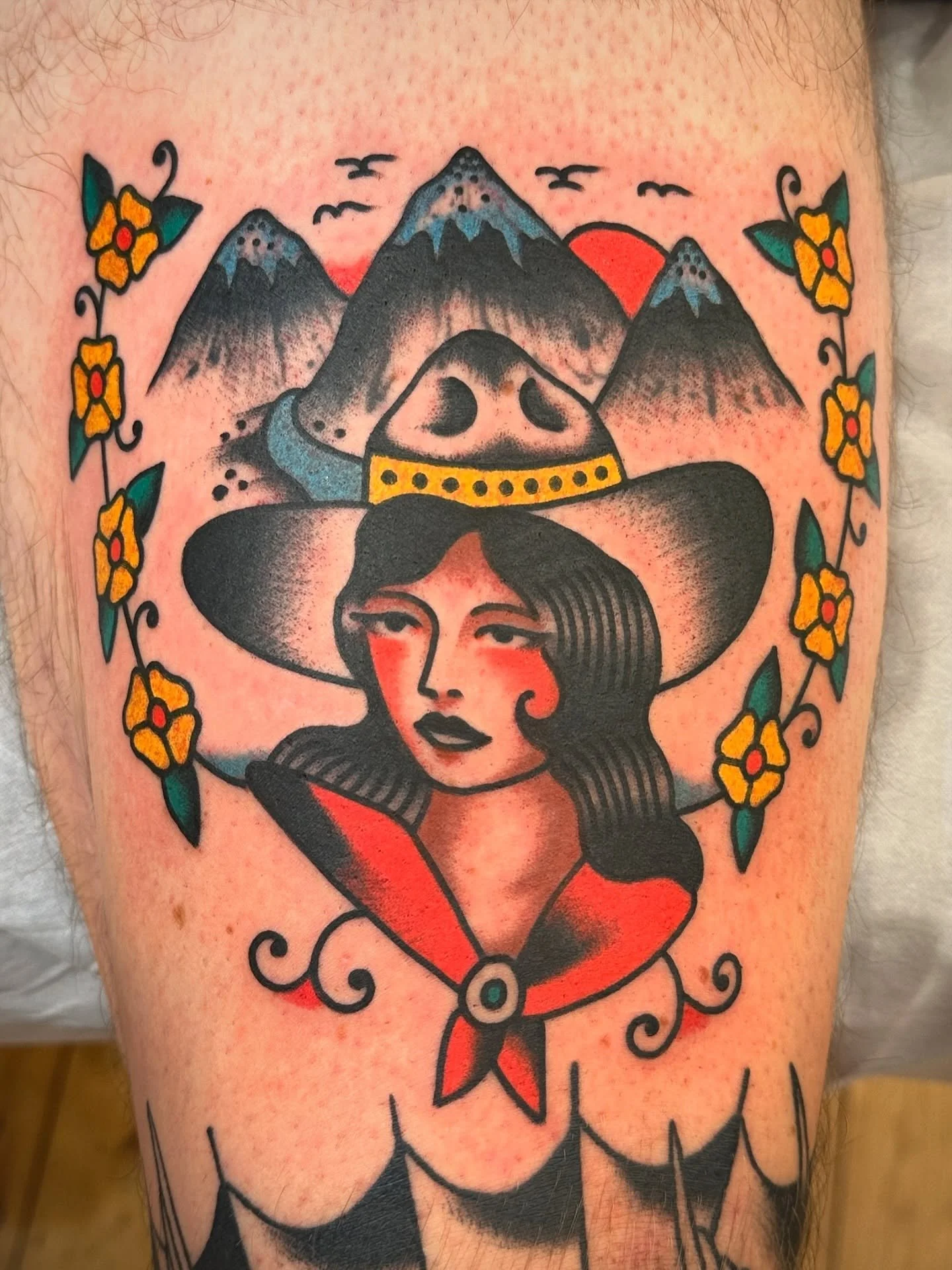 Traditional colour cowgirl and mountains tattoo made at Tattoo Rosie's Surry Hills, Sydney