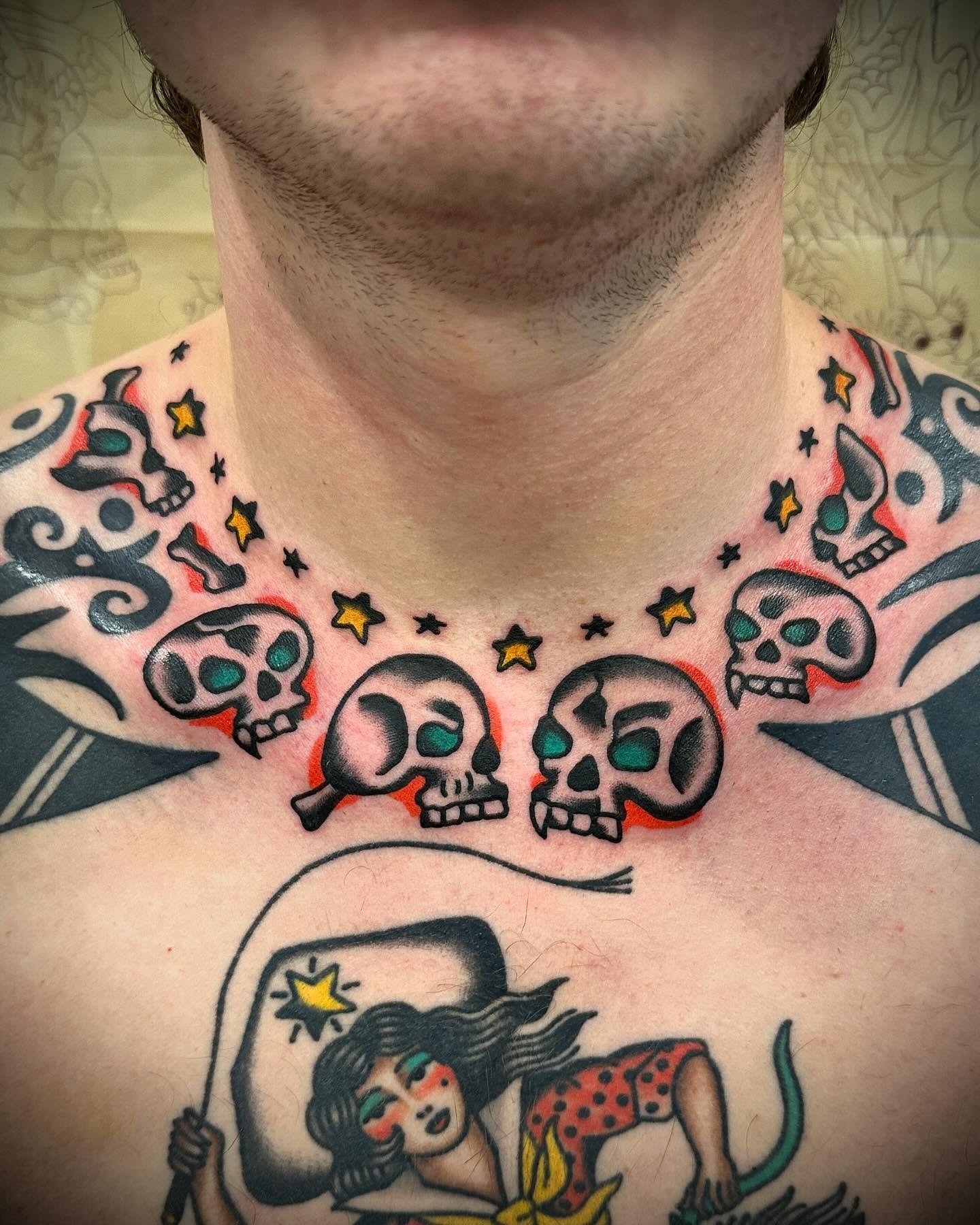 Traditional colour skull necklace tattoo made at Tattoo Rosie's Surry Hills, Sydney