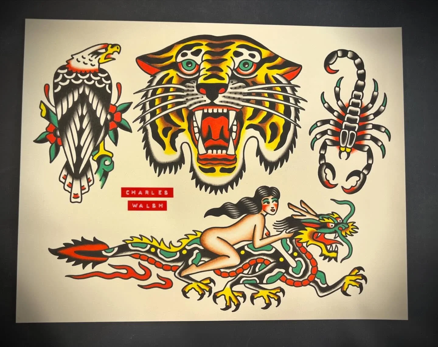 Tattoo-style artwork with a central tiger head, a woman riding a dragon, an eagle on the left with flowers, a scorpion on the right, and the text 'Charles Walsh' in red.