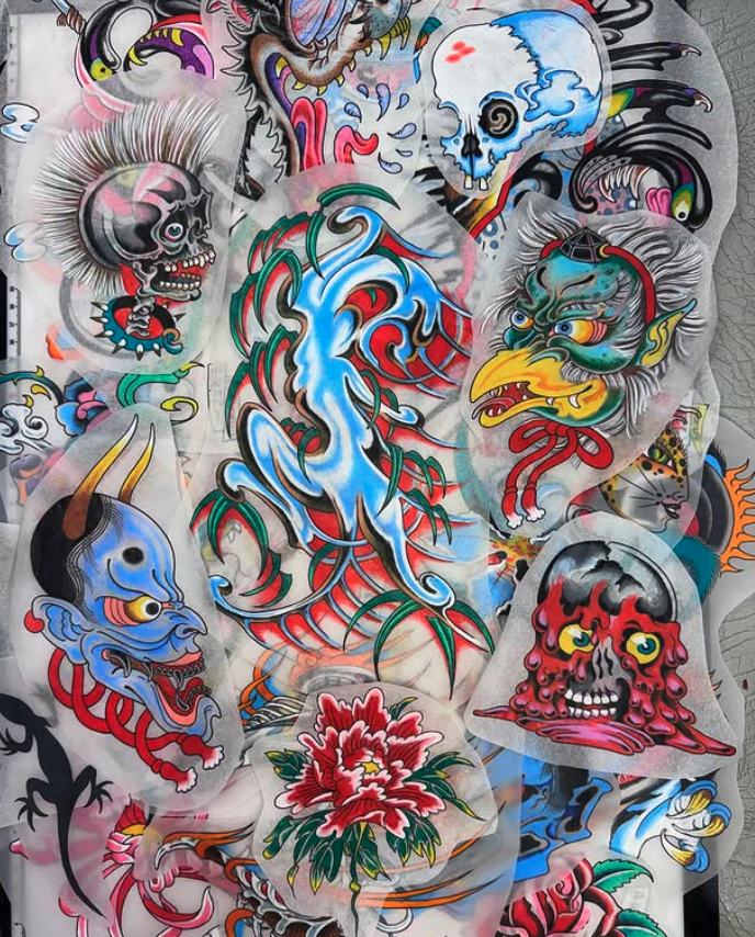 A collection of colorful traditional Japanese-style tattoo stickers featuring dragons, skulls, a lion, a fish, a flower, and mythical creatures.