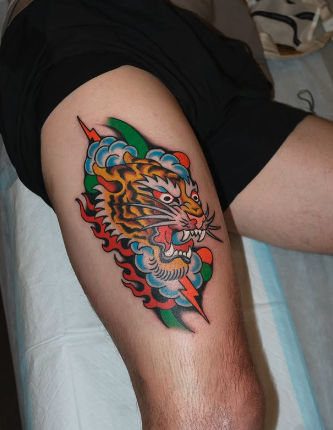 Traditional colour tiger thigh tattoo made by Benjamin Hastings at Tattoo Rosies, Surry Hills, Sydney 