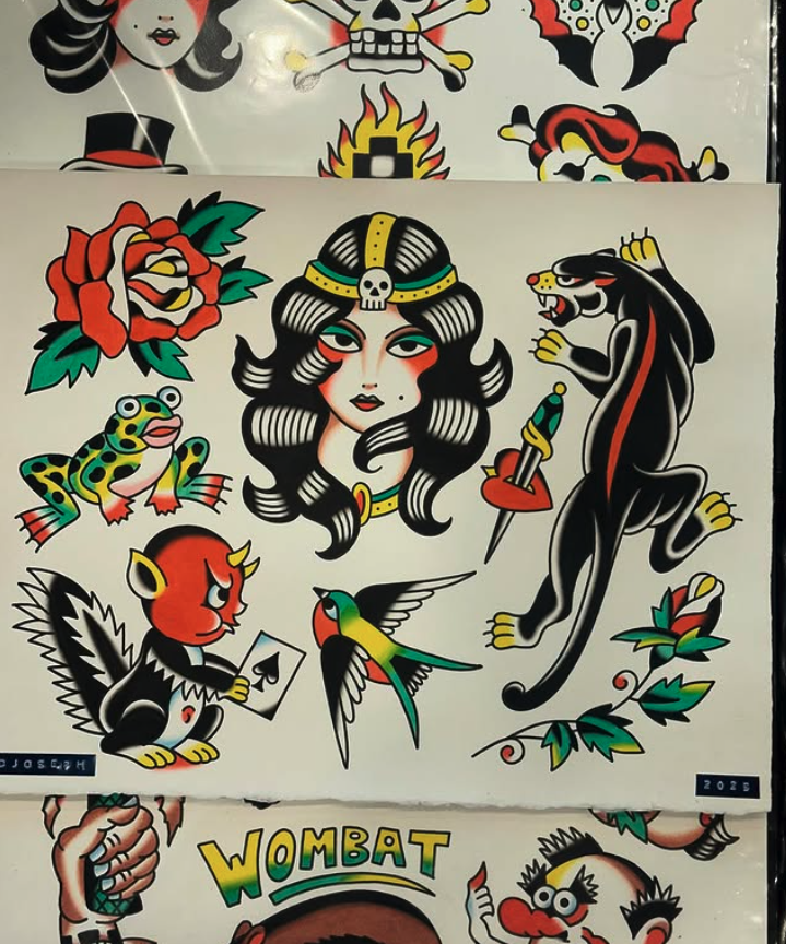 A collection of traditional American and Mexican tattoo-style images including a woman with black hair and a skull headpiece, a black panther with a dagger, a red rose, a frog, a red devil head, a colorful bird, and a woman with red cheeks and a card
