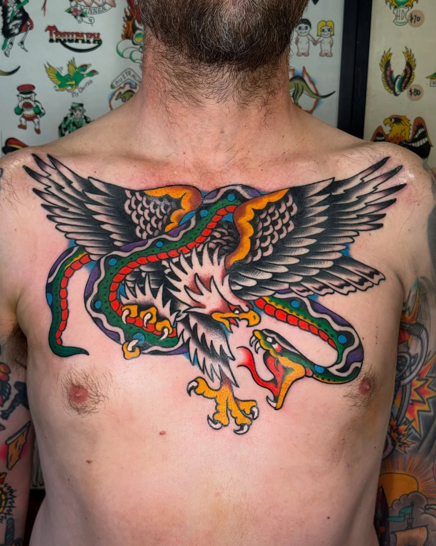 Traditional colour eagle and snake chest tattoo made by Benjamin Hastings at Tattoo Rosies, Surry Hills, Sydney 