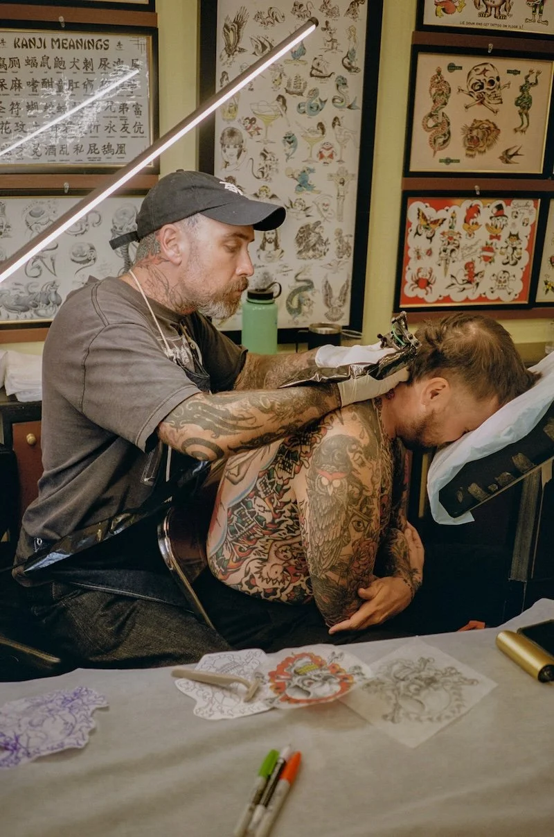 Zak Penny Tattooing back of client