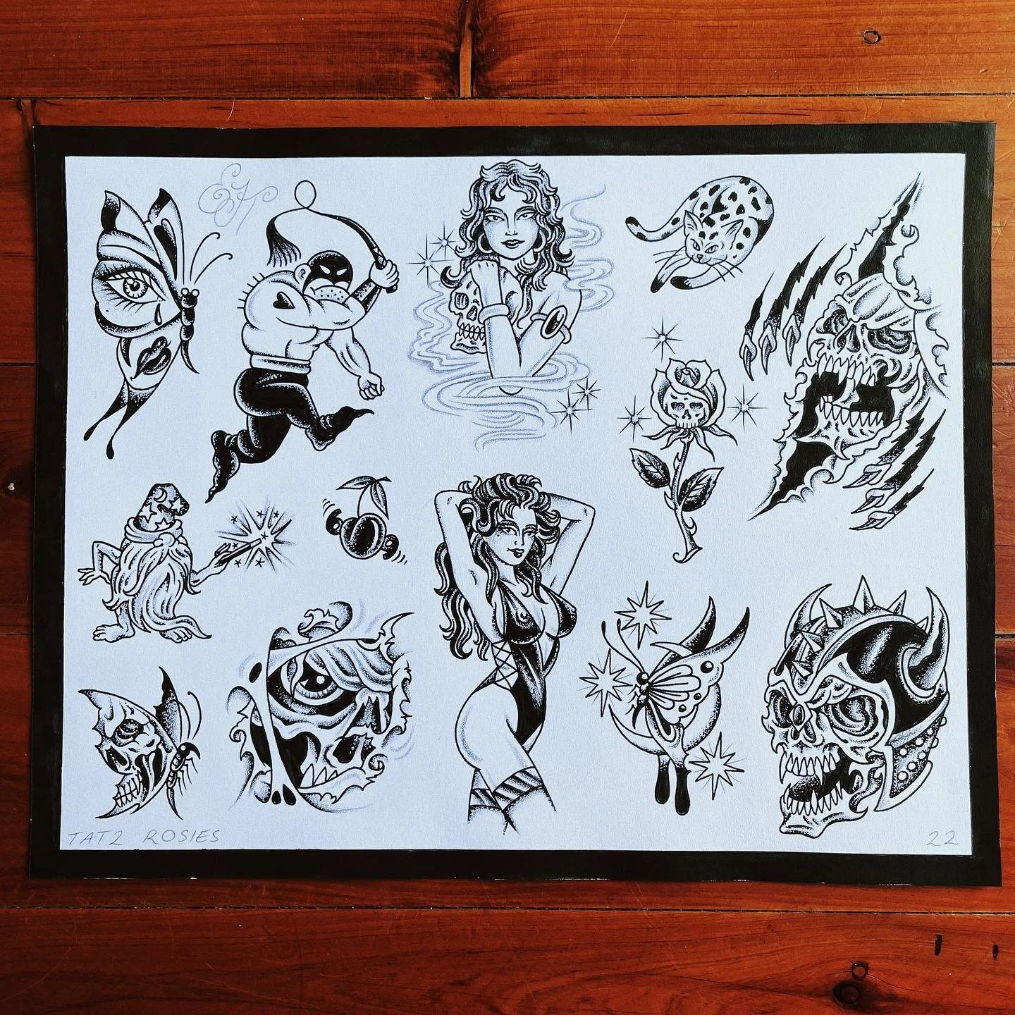 A collection of black and white tattoo-style illustrations including a butterfly with eye details, a muscular man fishing, a woman with curly hair surrounded by smoke, a leopard cat, a monster with claws, a flower with a skull, a woman in lingerie, a