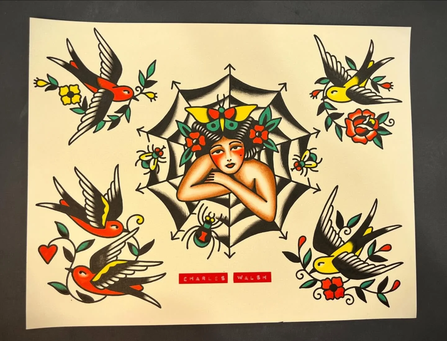 Traditional tattoo-style artwork featuring a woman with flowers in her hair, surrounded by six colorful birds flying around a spider web, with flowers and leaves.