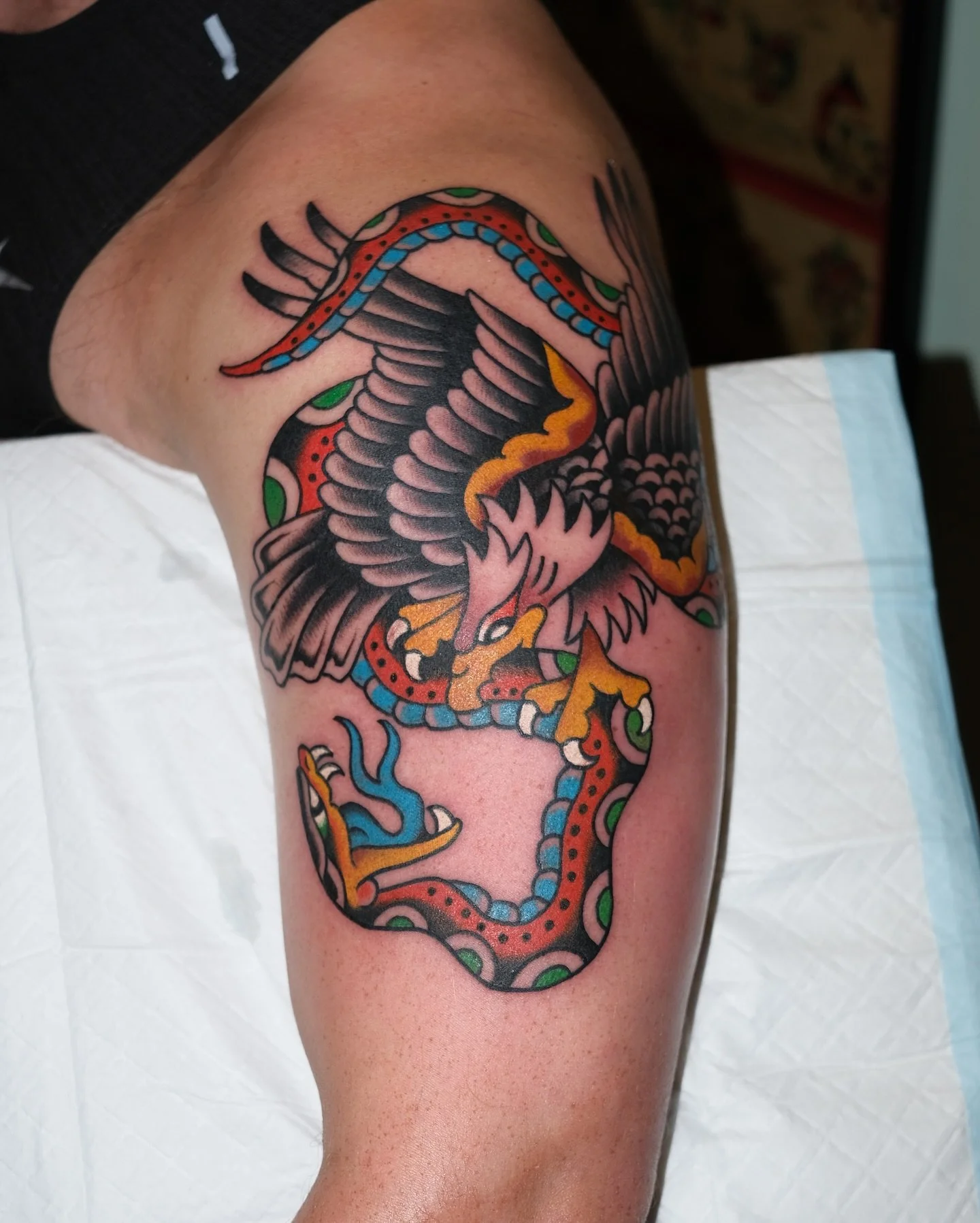 Traditional colour eagle and snake tattoo made by Benjamin Hastings at Tattoo Rosies, Surry Hills, Sydney 