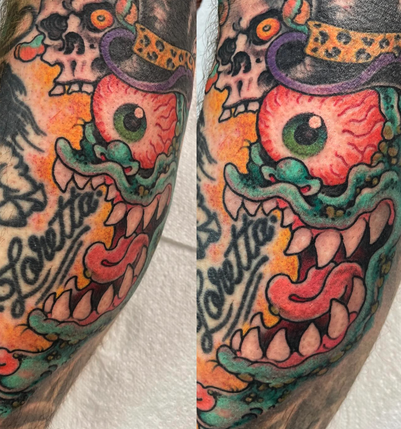 Colorful tattoo of a cartoonish monster face with sharp teeth, a large eye, and a snake-like tongue, with a top hat and leopard print hat accessories.