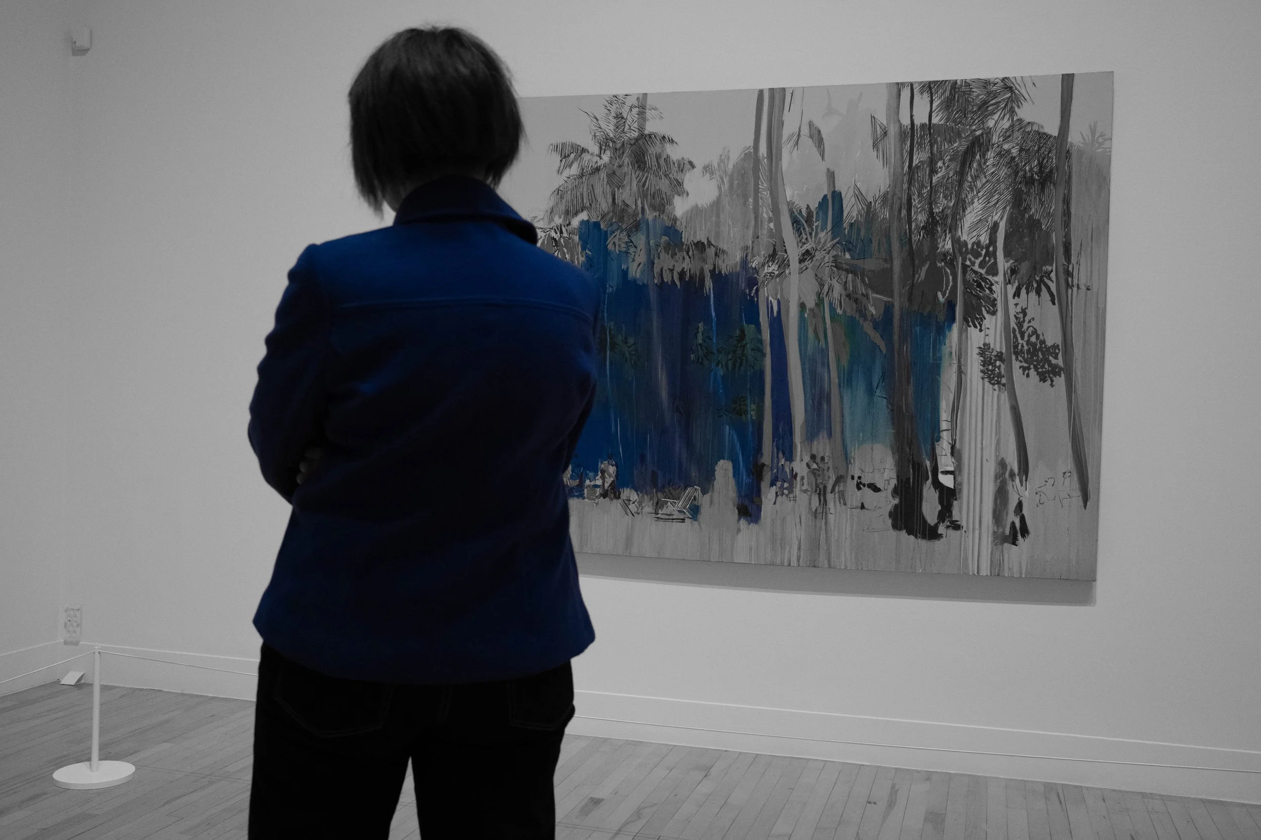 I loved the way that the blue of this woman's jacket starts to blend in with the painting.
