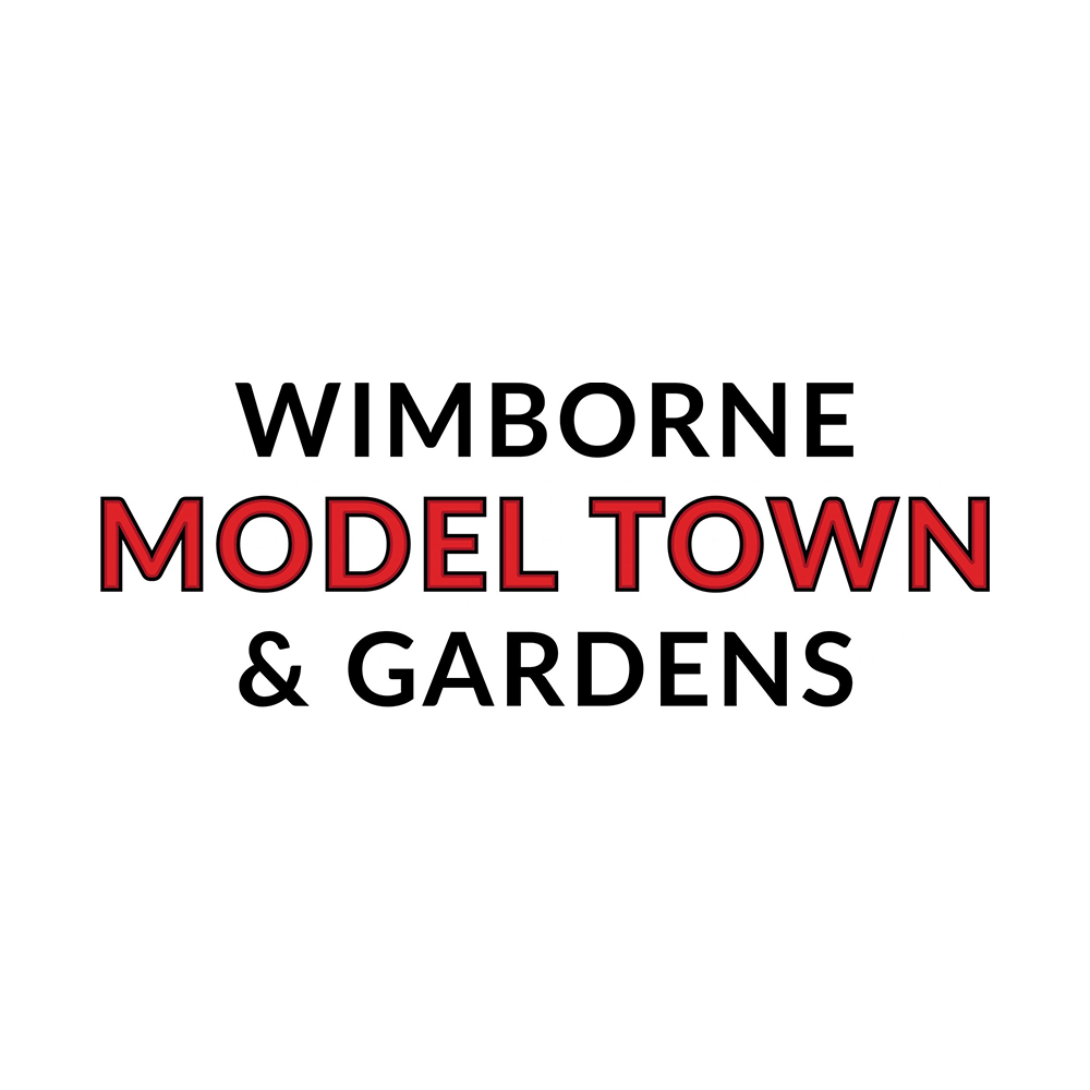 Sign for Wimborne Model Town & Gardens with black background and white and red text.