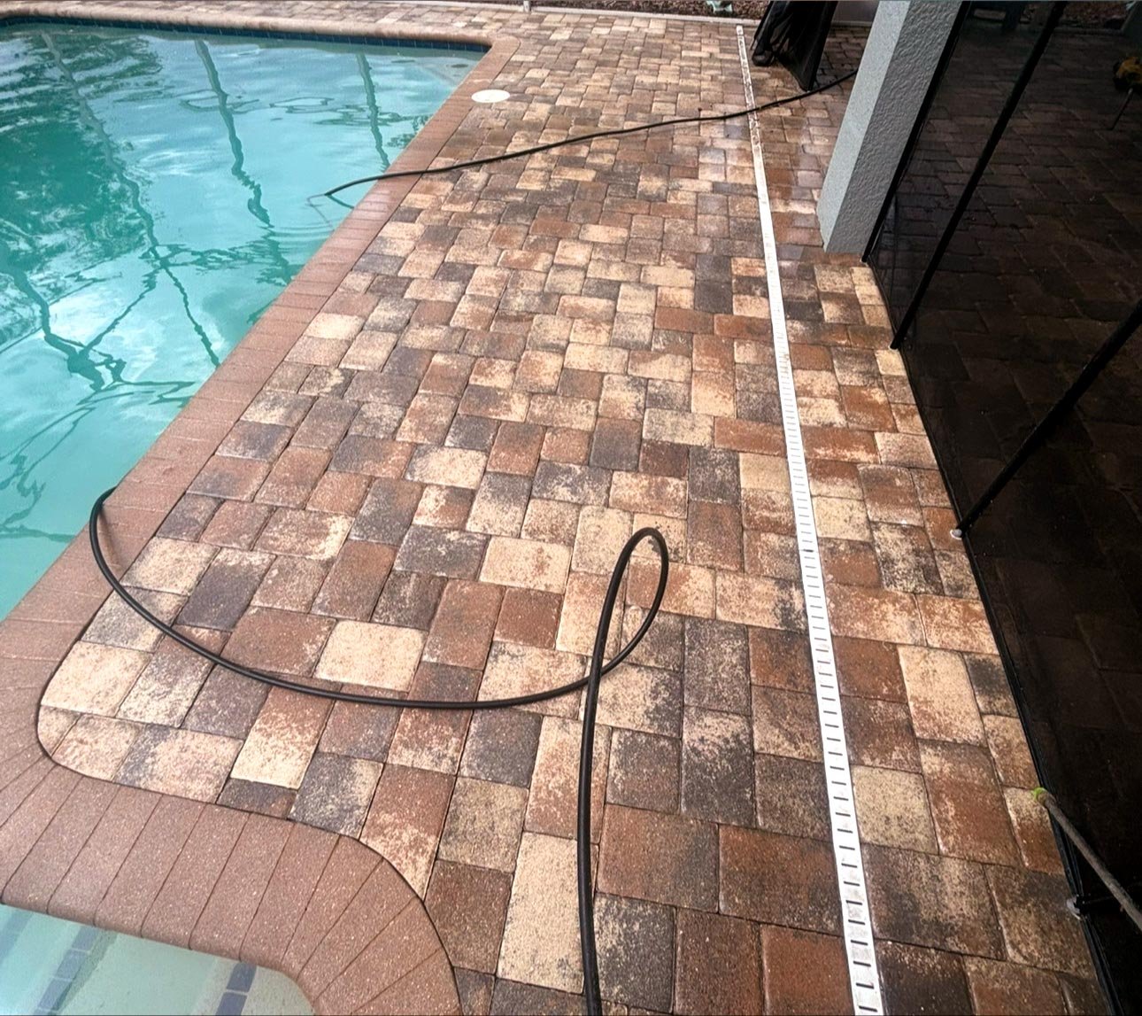 Pool pavers after being pressure washed.