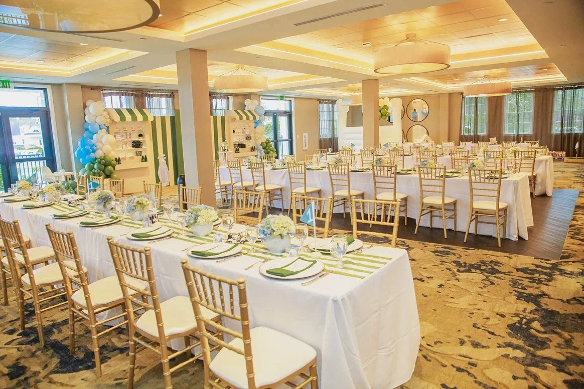 Golf birthday banquet room with striped table runners and hydrangea centerpieces at Dominion Valley Country Club in Haymarket, VA
