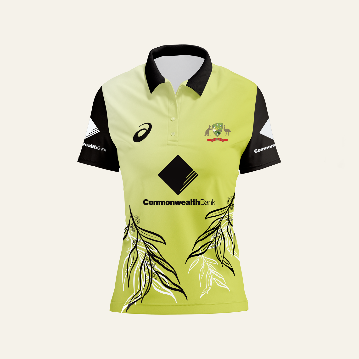 A yellow and black sports shirt with various logos and a graphic of leaves on the lower front.