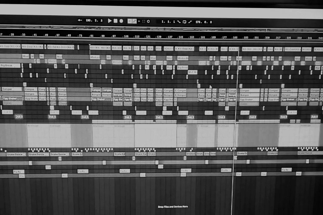 Screenshot of a digital audio workstation with multiple tracks and audio clips arranged in a sequence.