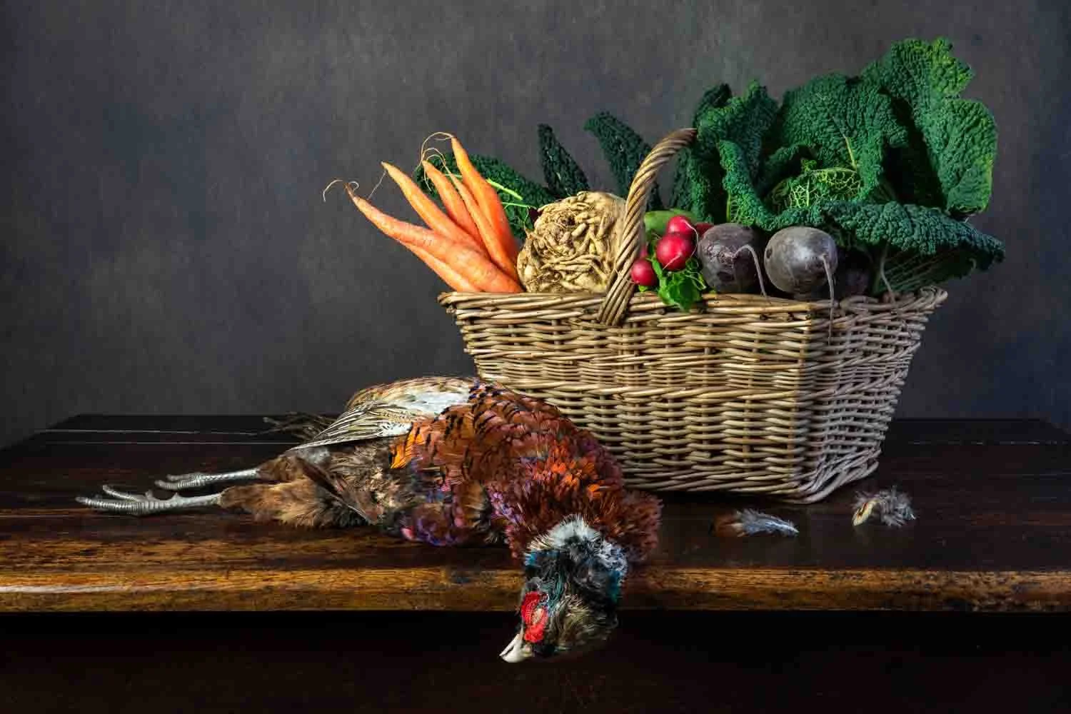 Still life of pheasant, carrots, celeriac, beetroot, radishes and kale, photographed by Wendy Akers 