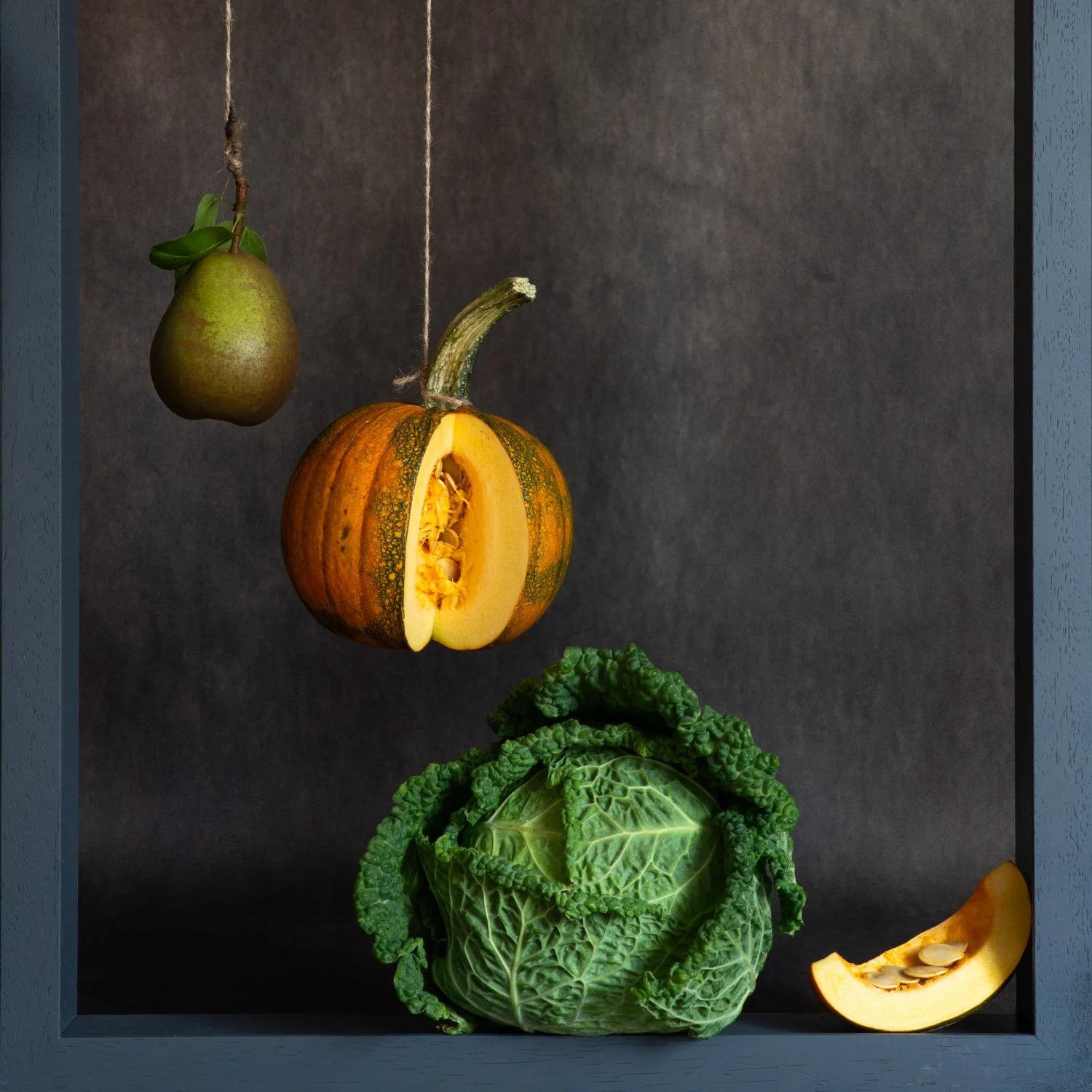 Hanging vegetables and fruit in homage to Juan Sanchez Cotan