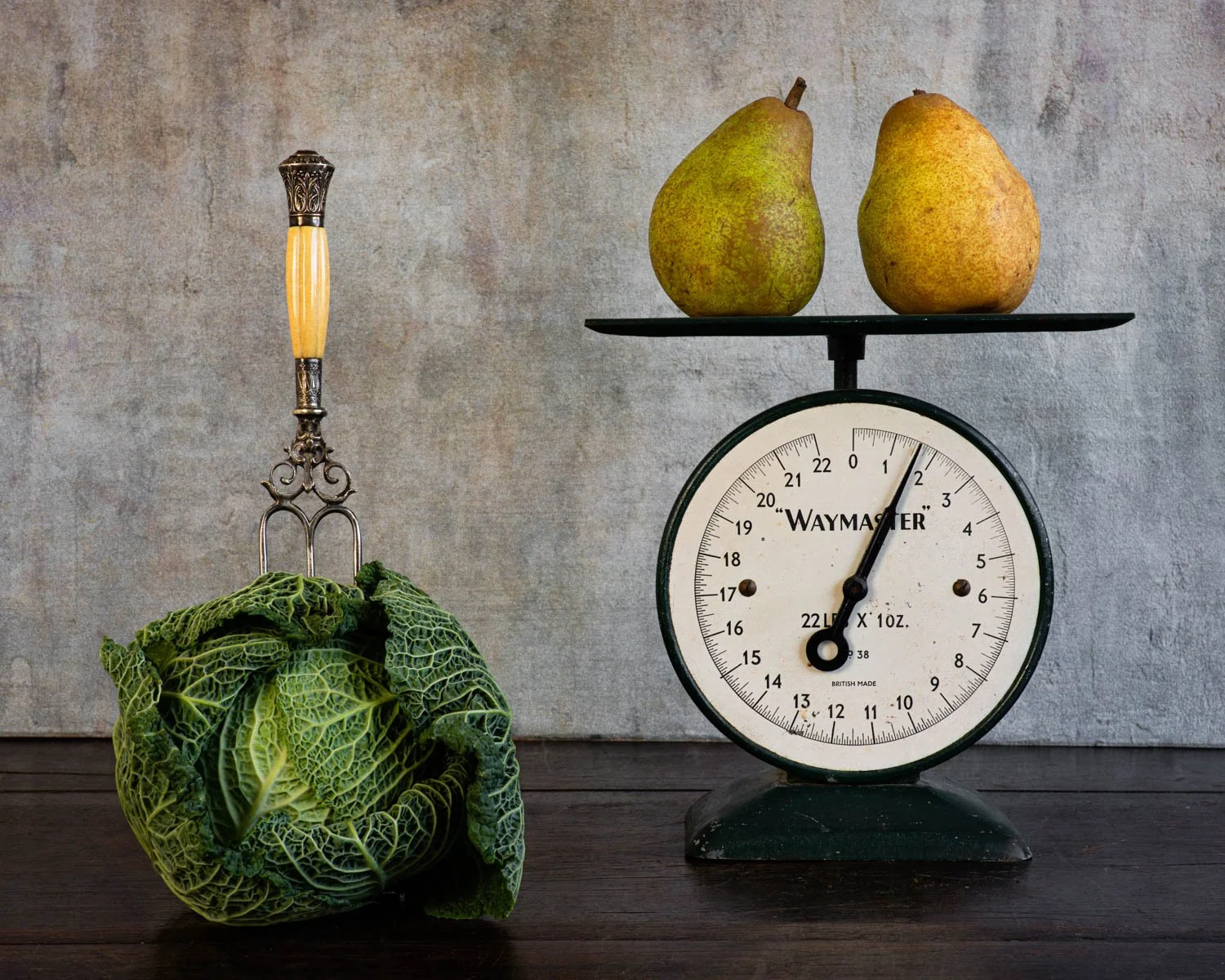 Still life of two pears on scales and a cabbage, by Wendy Akers