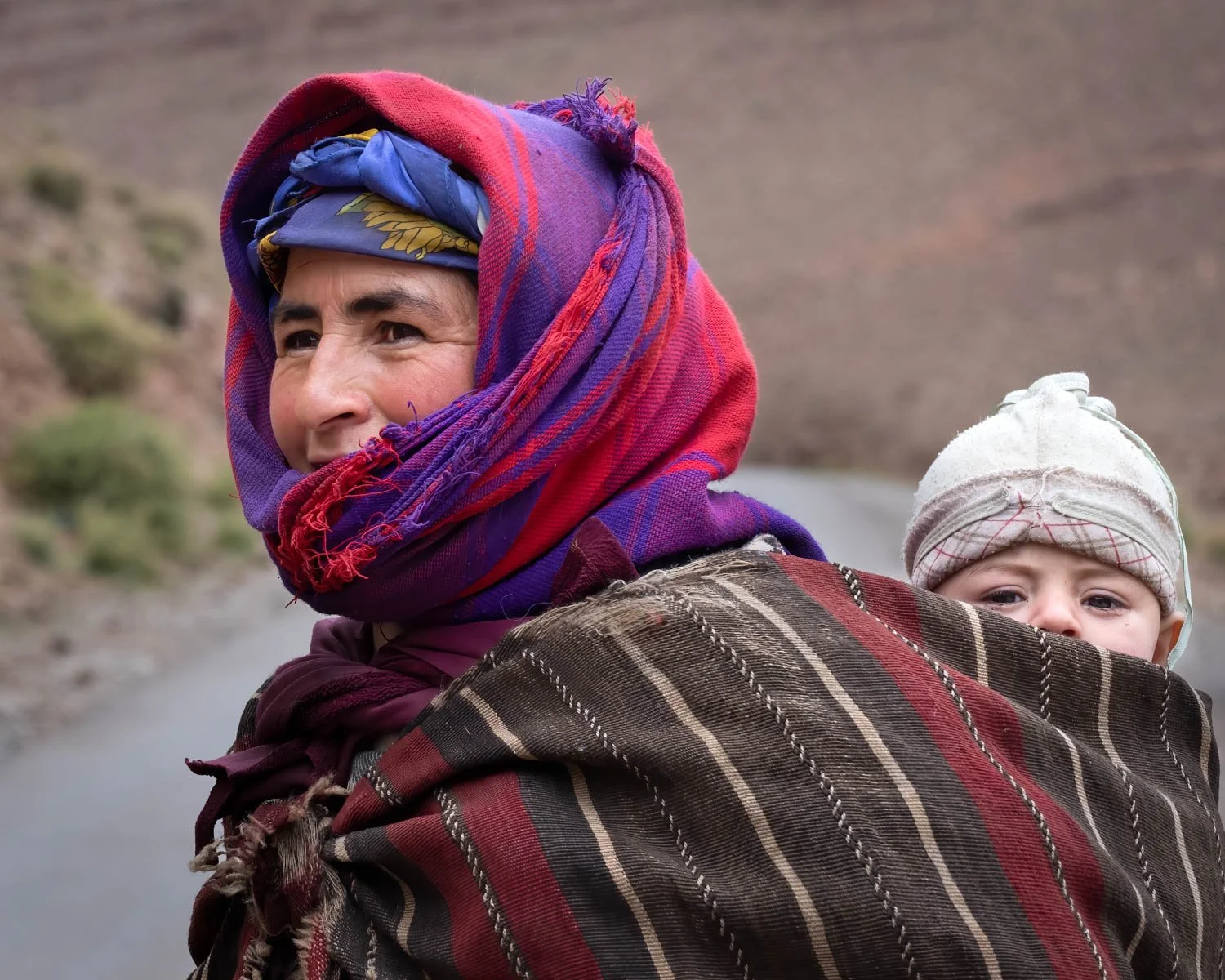 Moroccan goat herder woman and baby, photographed by Wendy Akers