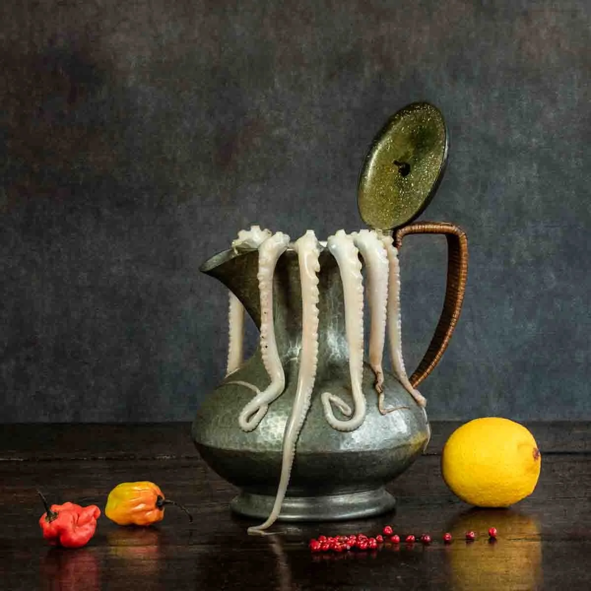 Still life of octopus, coffee pot, lemon and peppers, photographed by Wendy Akers
