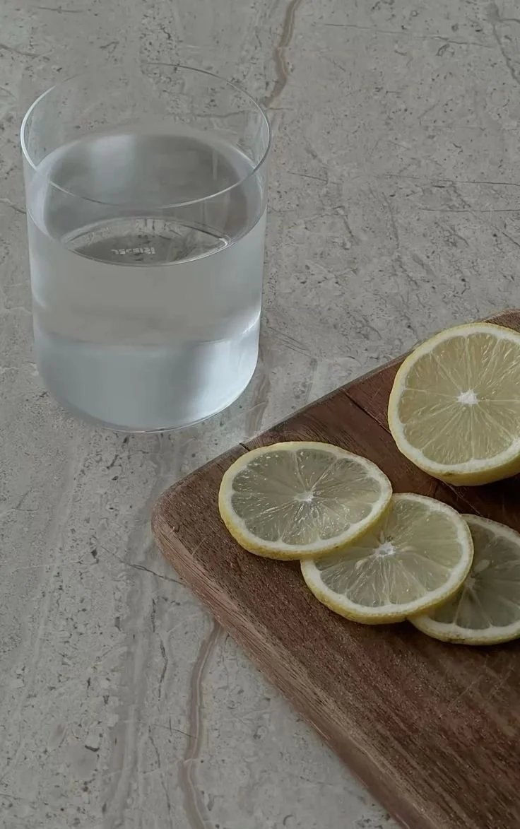 A glass of water with slices of lemon