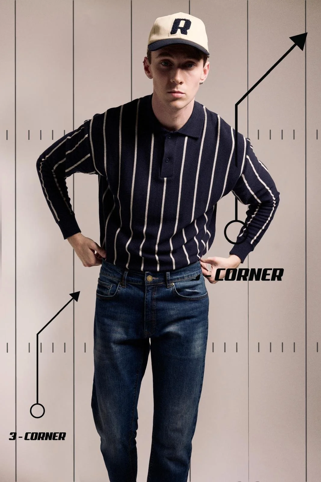 A young man standing with his hands on his hips in front of a beige background with graphic lines and labels indicating corners and angles.