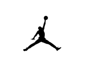 Silhouette of a person jumping with one arm raised holding a basketball.