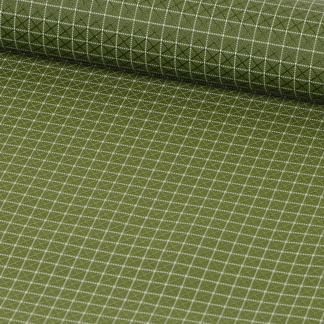 Close-up view of a green fabric with a white grid pattern.