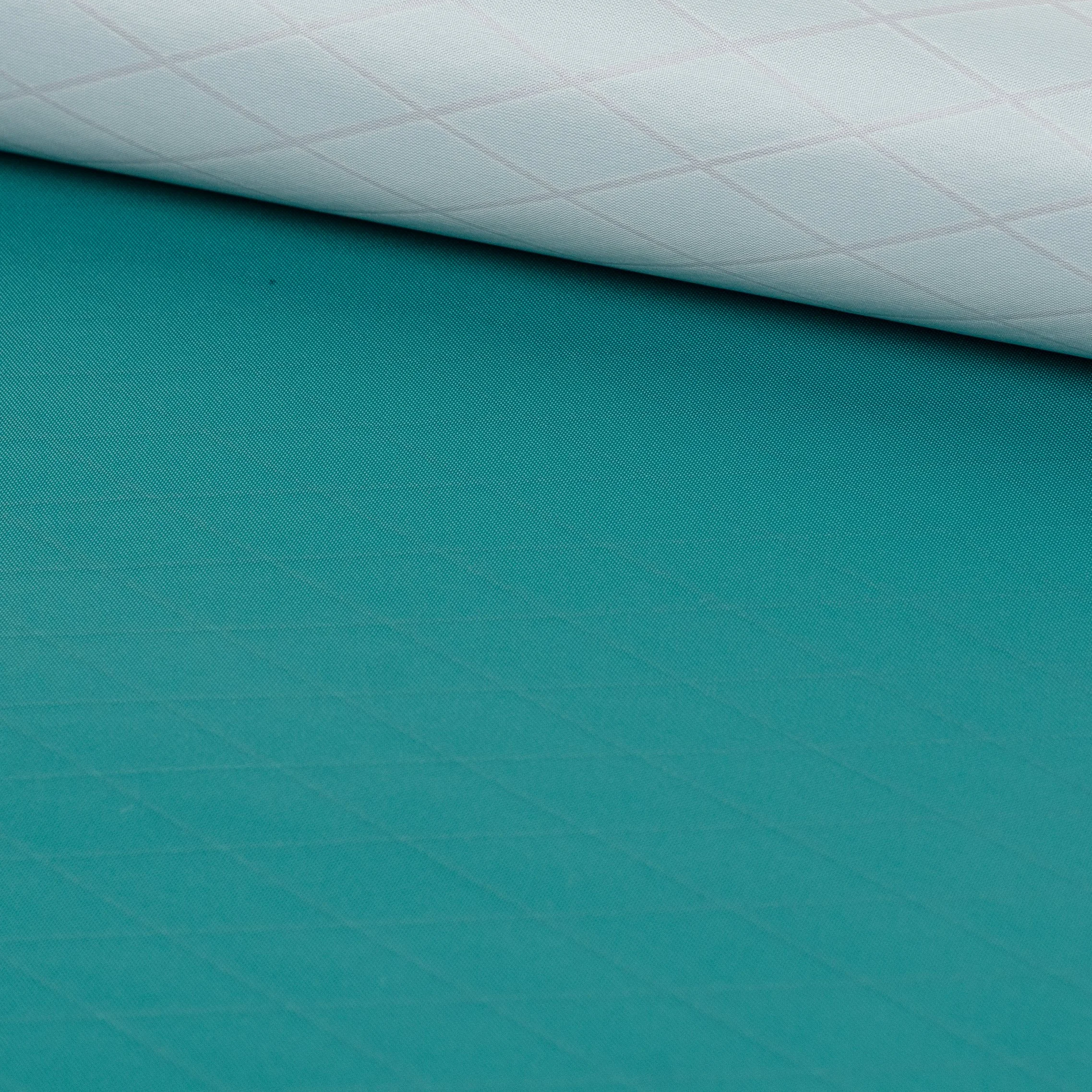 Close-up of a rolled up piece of green textured fabric.