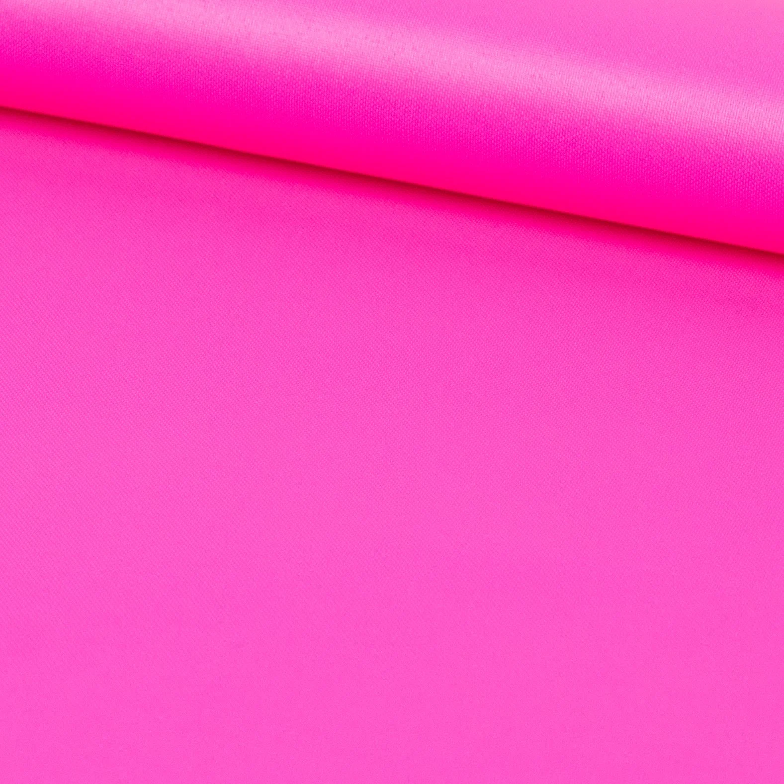 Close-up of a pink fabric with a folded edge.