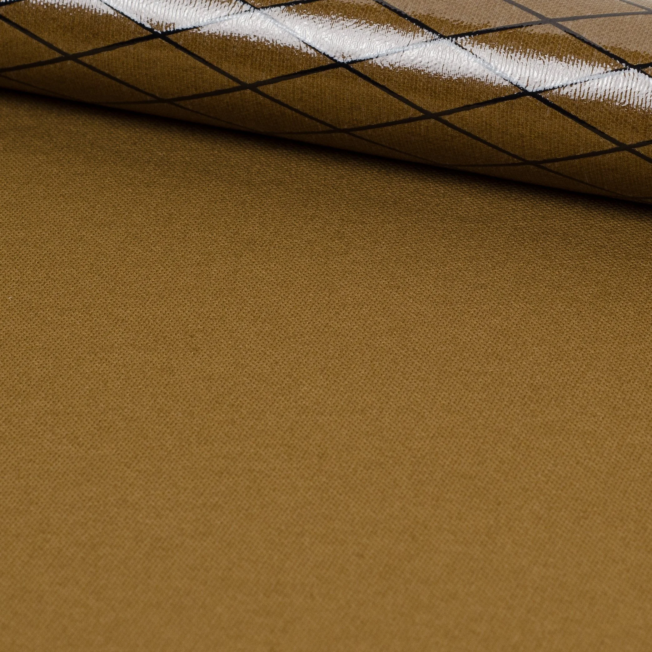 Close-up of a rolled up piece of brown textured fabric.