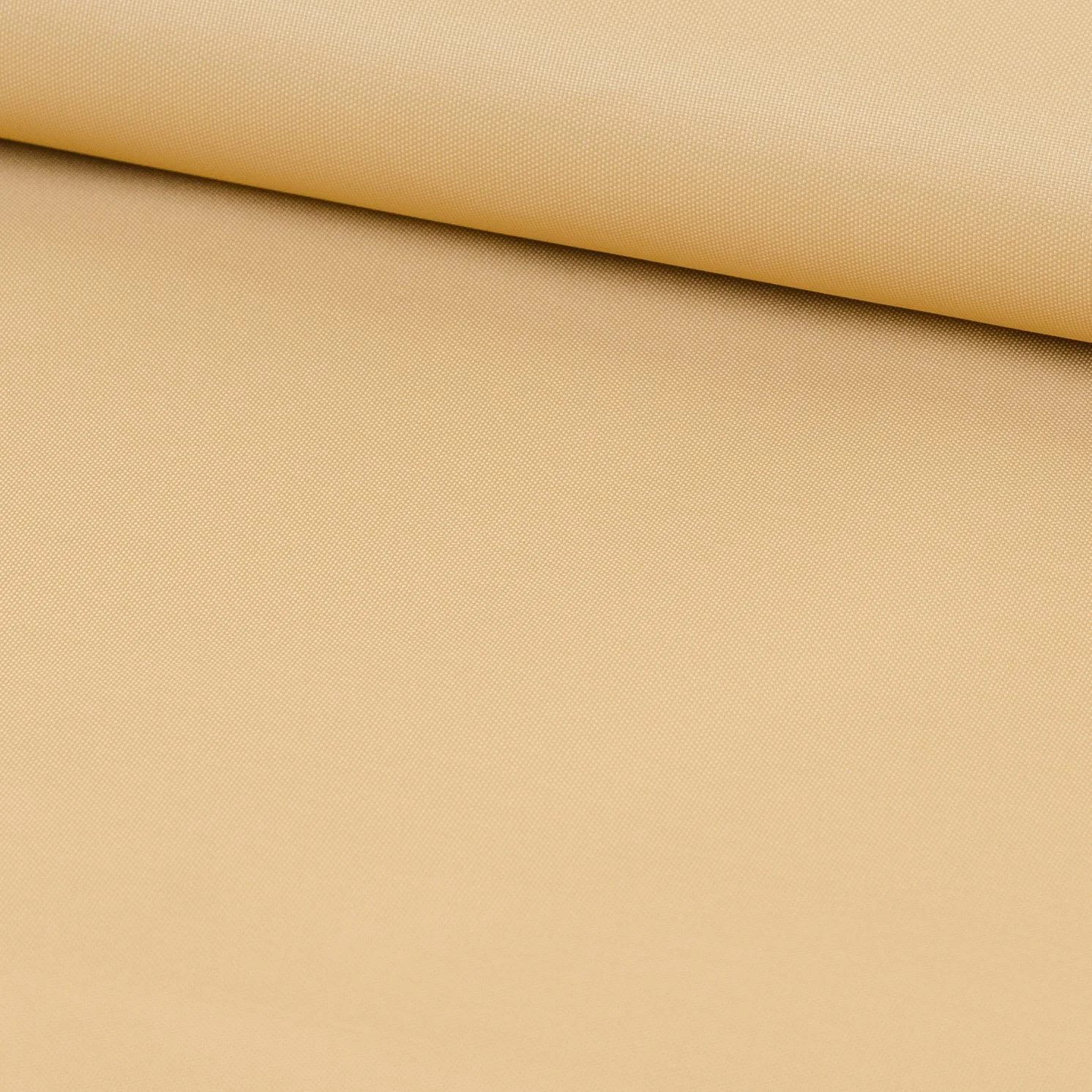 Close-up of beige fabric with a textured surface.