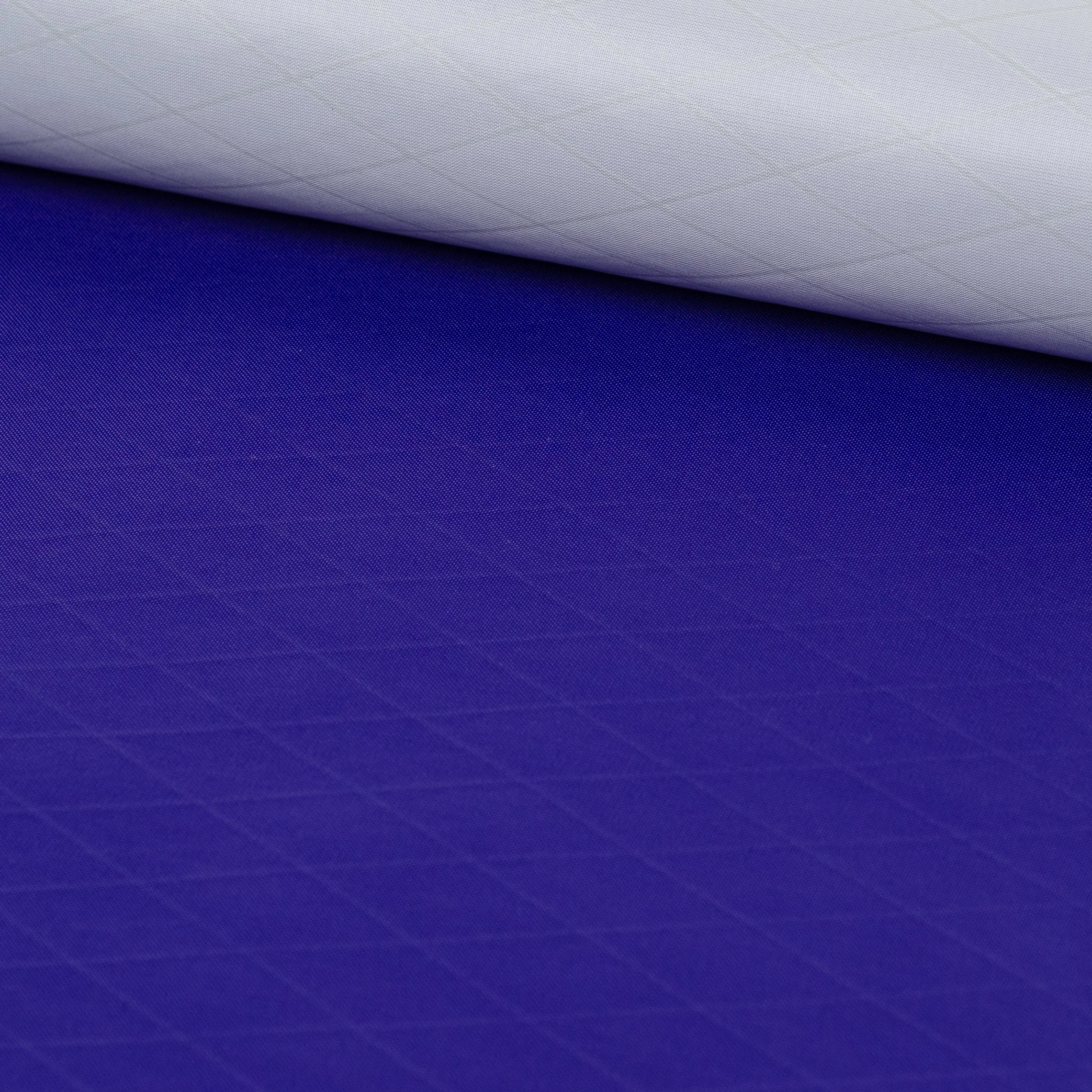 Close-up of a rolled up piece of purple textured fabric.
