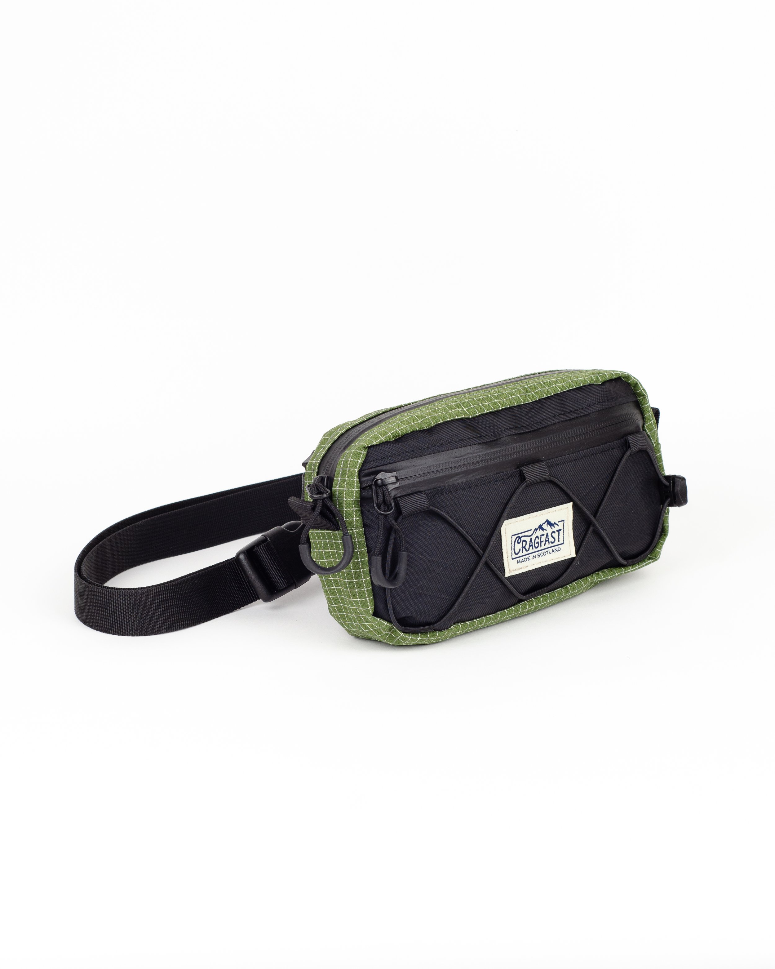 A black and green Cragfast waist pack with adjustable strap and multiple compartments, placed against a white background.
