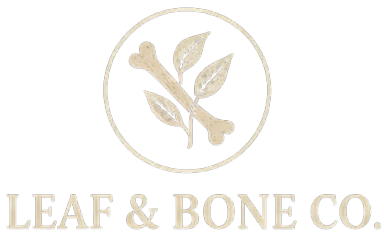 A black logo with a beige leaf and bone design inside a circle, with the text 'LEAF & BONE CO.' below.