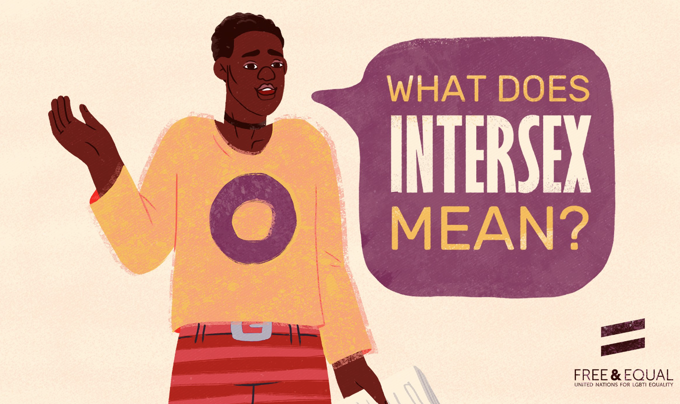Illustration of a woman with short hair, wearing a yellow hoodie with a purple circle on it, and red striped pants. She is gesturing with her right hand while holding a paper in her left hand. There is a speech bubble that reads 'What does Intersex m