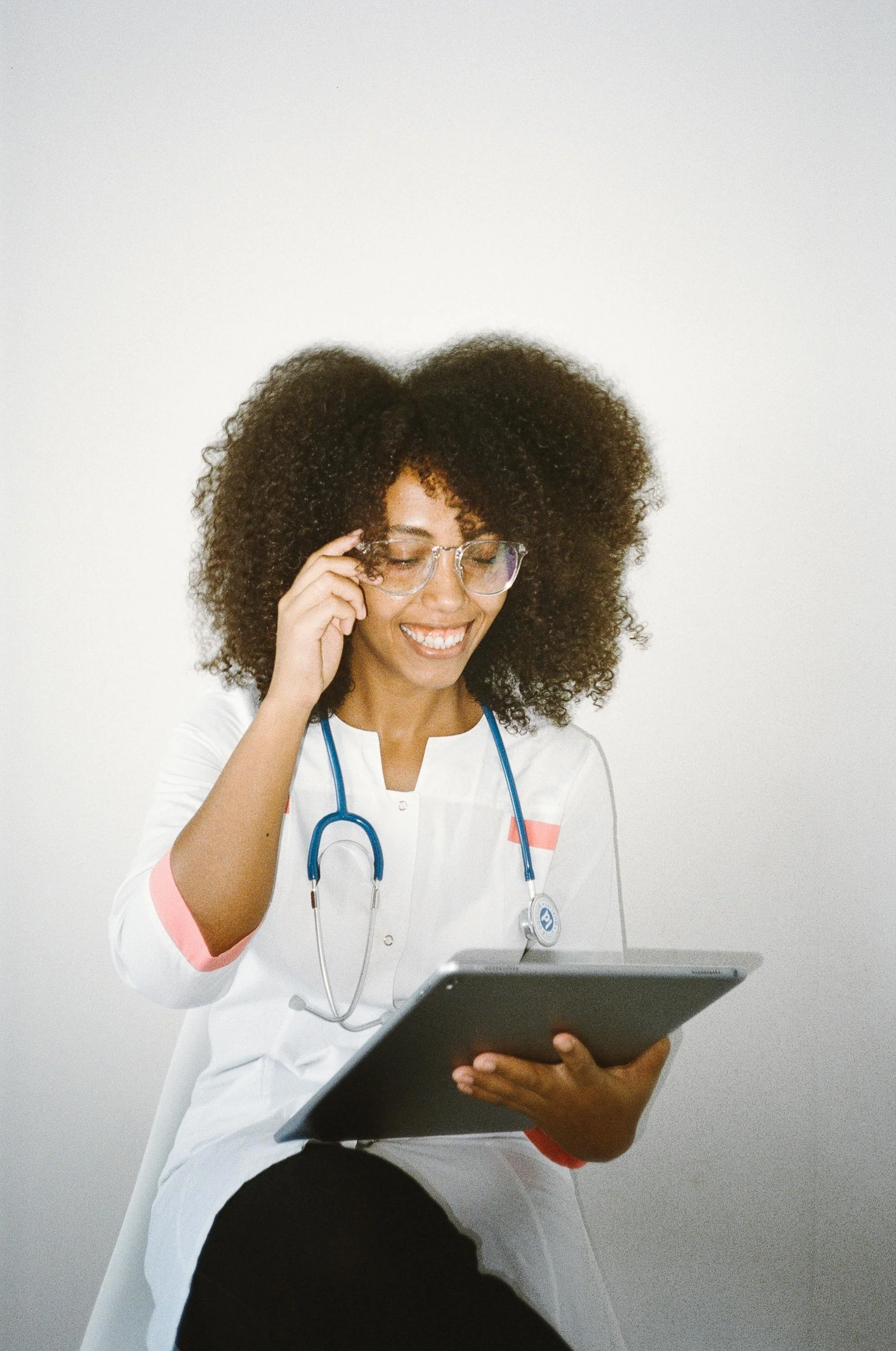 A woman first responder writing on a tablet, representing first responder therapy and EMDR treatment for helping professionals near Glendale, AZ at Inside Out Therapy