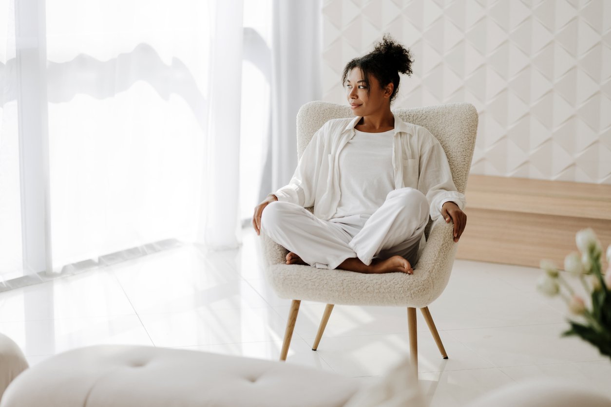 A person sitting quietly in a calm setting representing body-based anxiety therapy at Inside Out Therapy and Consulting in Peoria, AZ