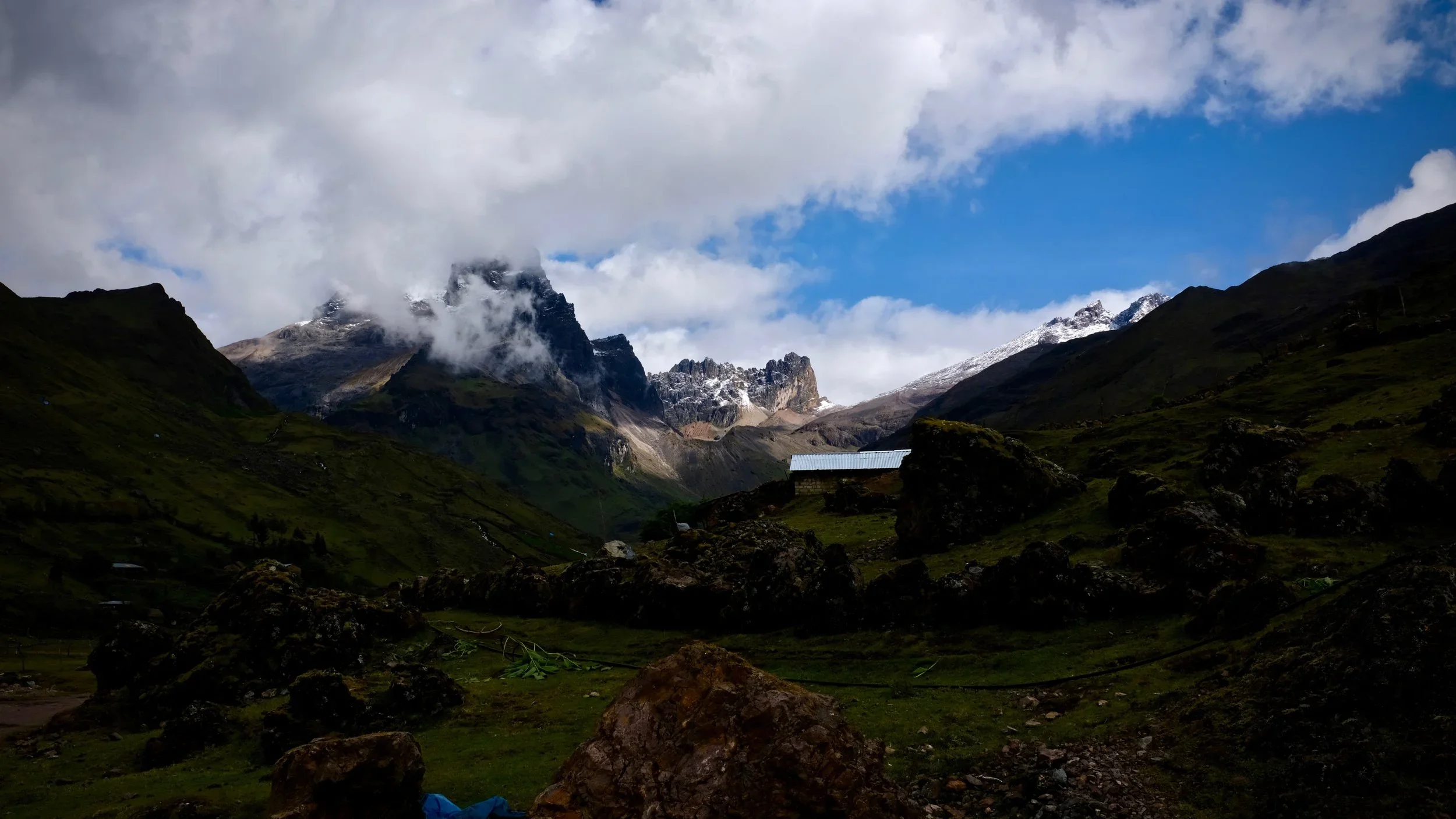 Clouds settle over the peaks flanking Cuncani.