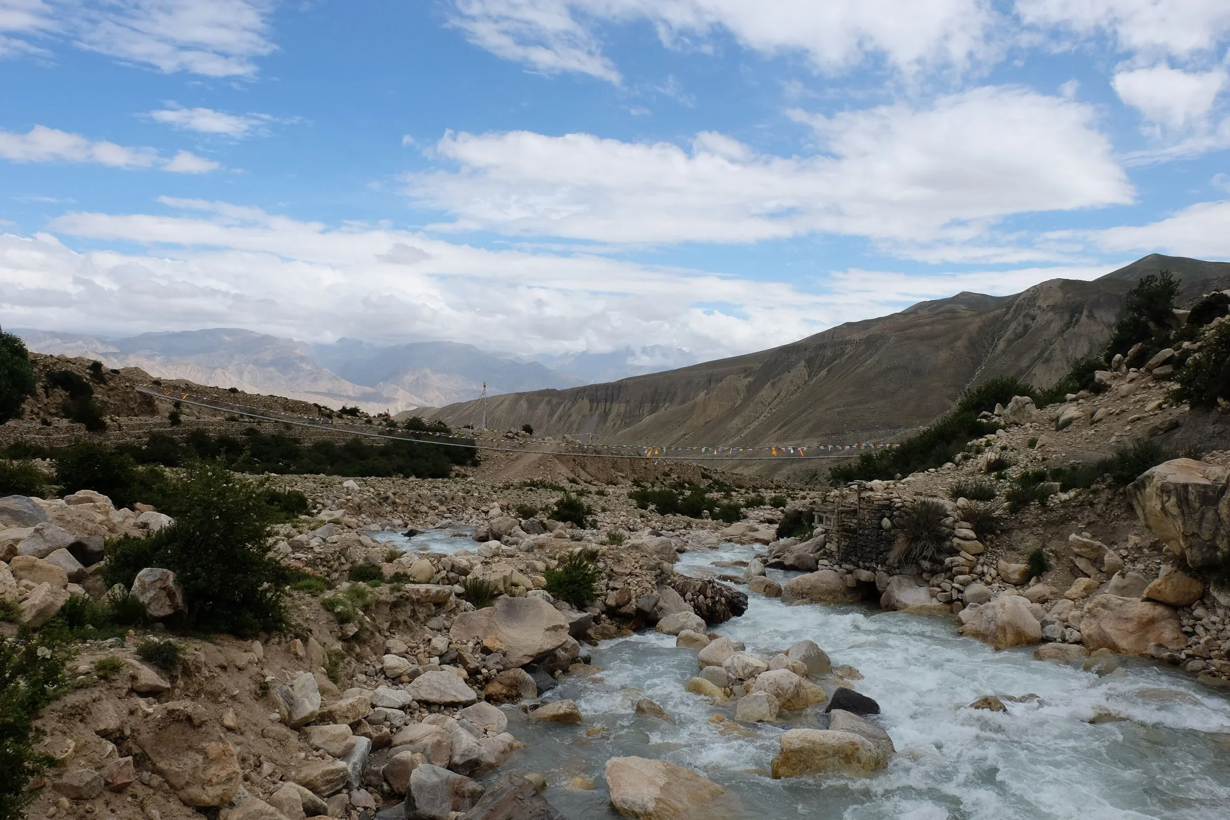 Rushing waters and cloudy skies during one of the research team's recruitment treks.
