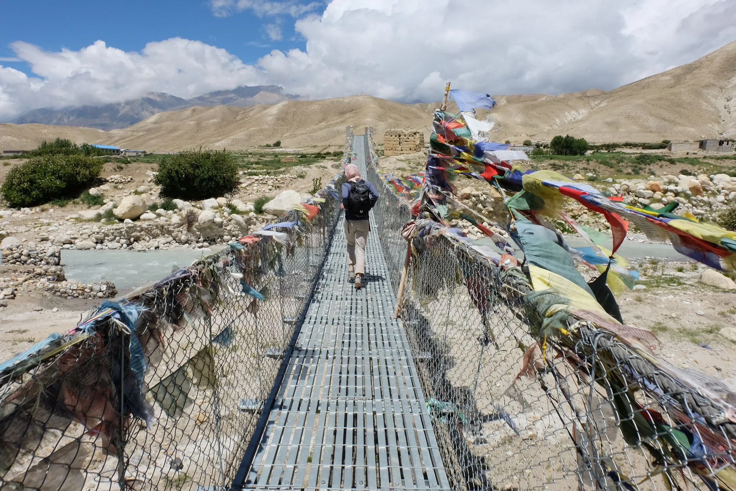 
The research team traversed many flag-ridden walkway bridges while seeking research participants from other villages.