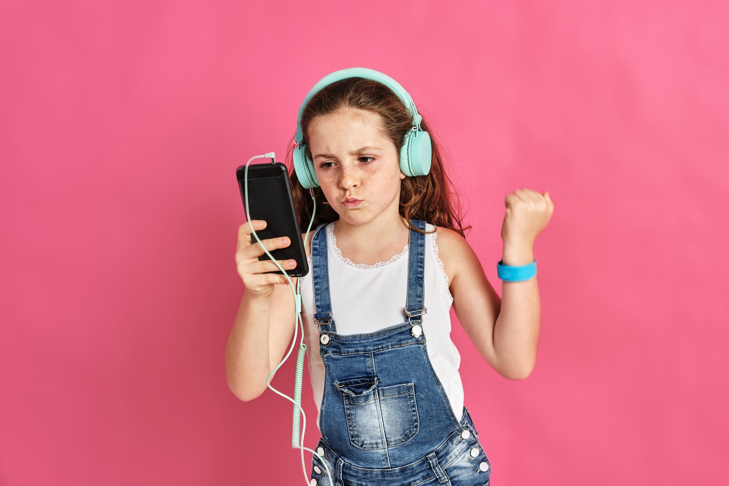 cute-little-girl-listening-music-with-phone-headphones.jpg