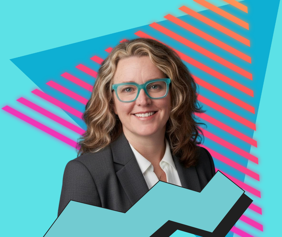 A smiling woman with wavy brown hair, styled in loose curls, wearing teal glasses, a white shirt, and a dark blazer. The background features vibrant geometric shapes and colorful diagonal lines.